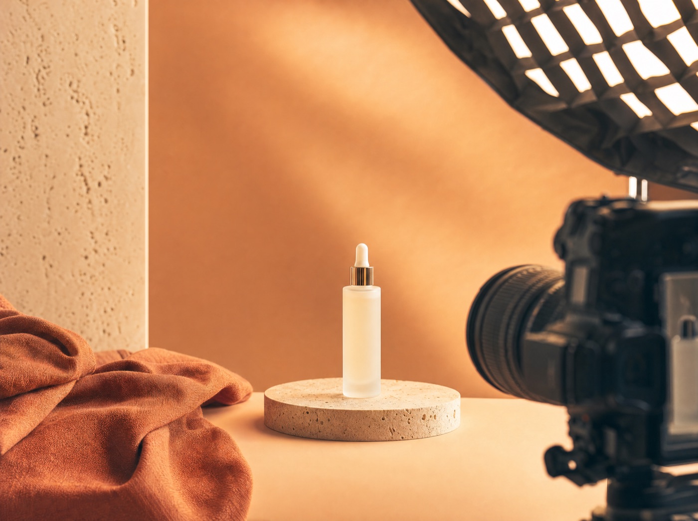 A product photoshoot set with softbox lighting on a warm backdrop